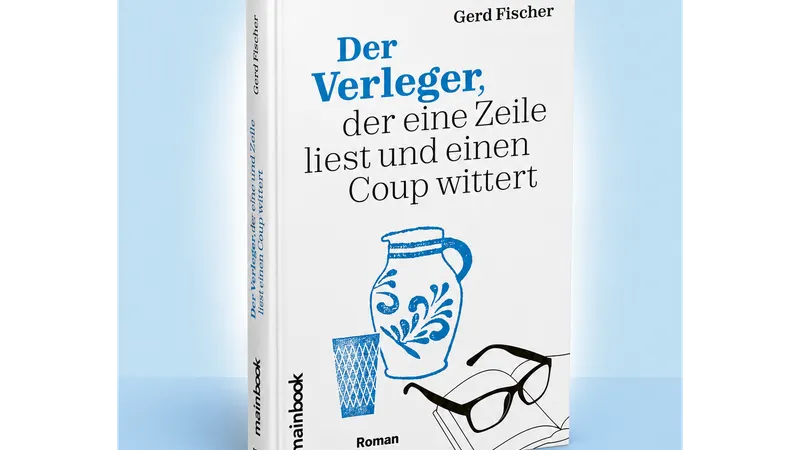 Autor und Verleger Gerd Fischer signiert seinen Roman "Der Verleger, der eine Zeile liest und einen Coup wittert