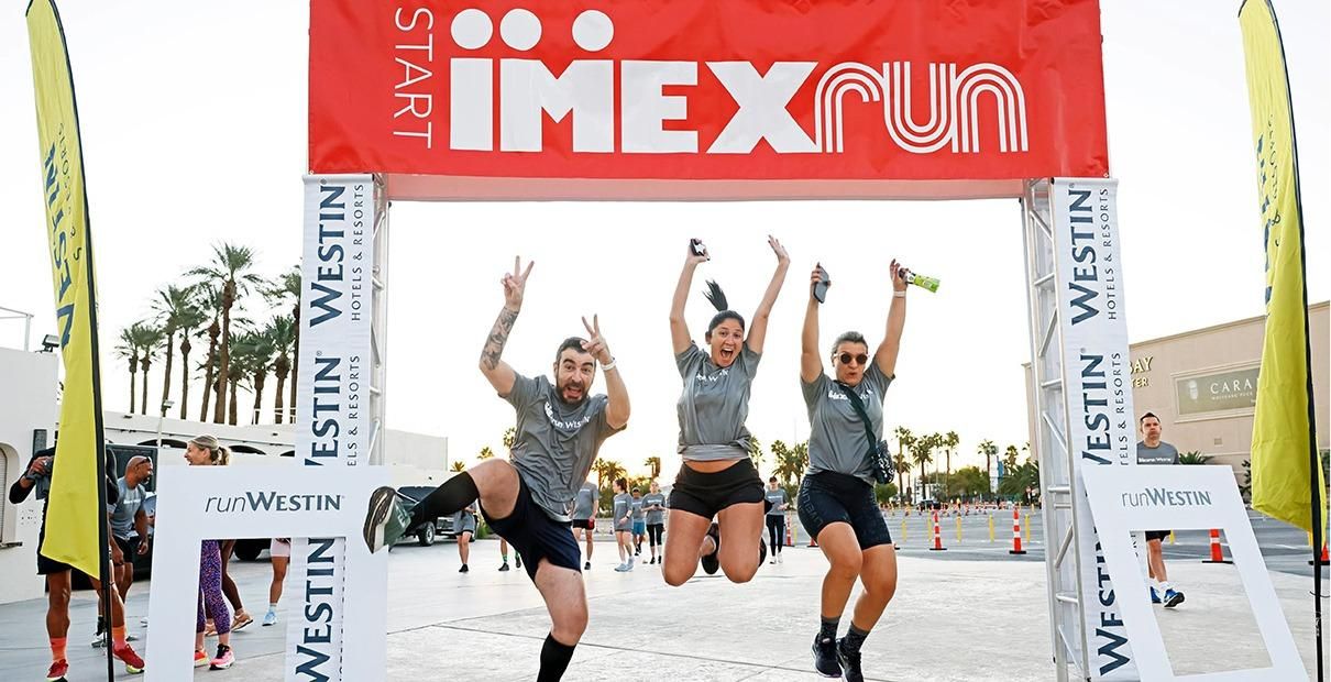 Runners at IMEX run start line cheering and ready to start their race