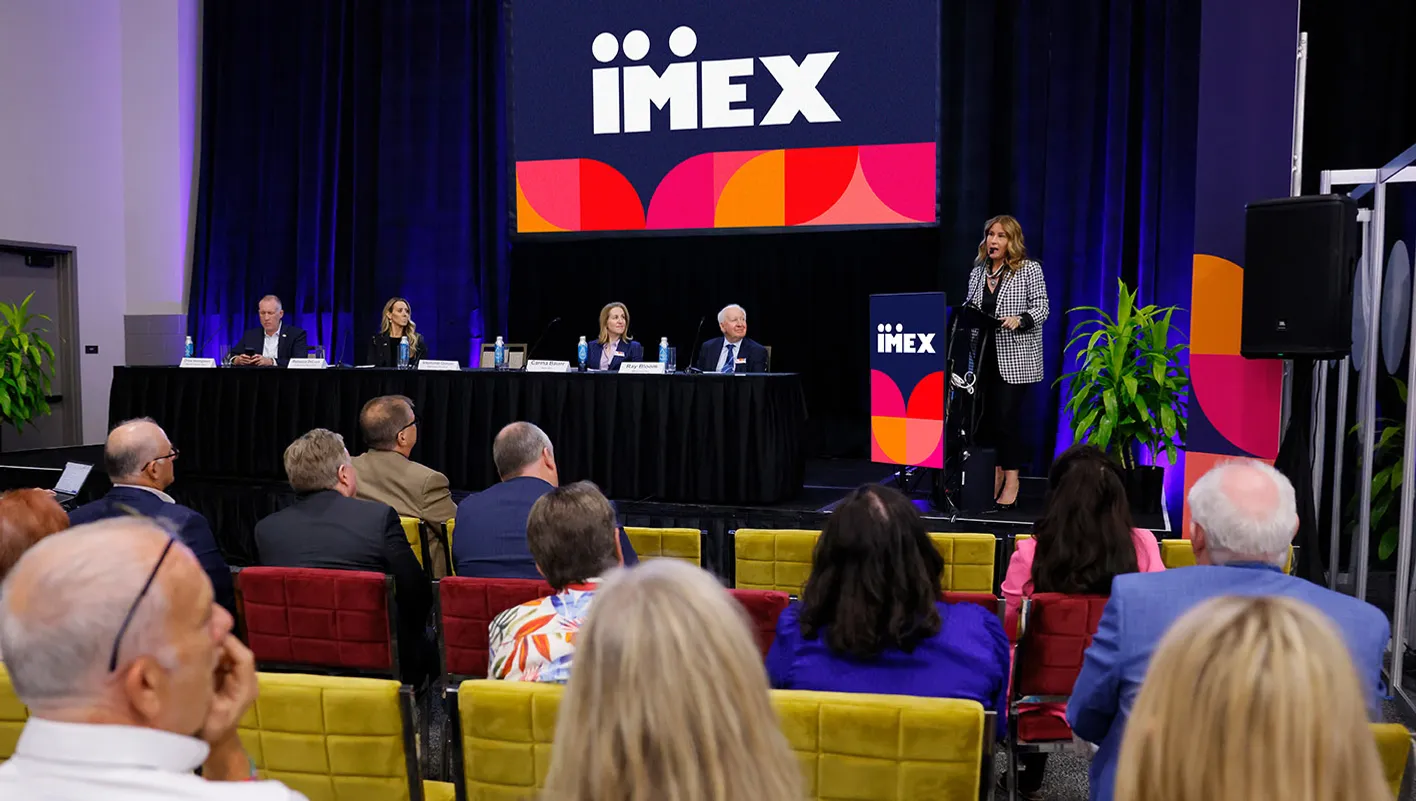 Speakers on stage during IMEX press conference in the press center
