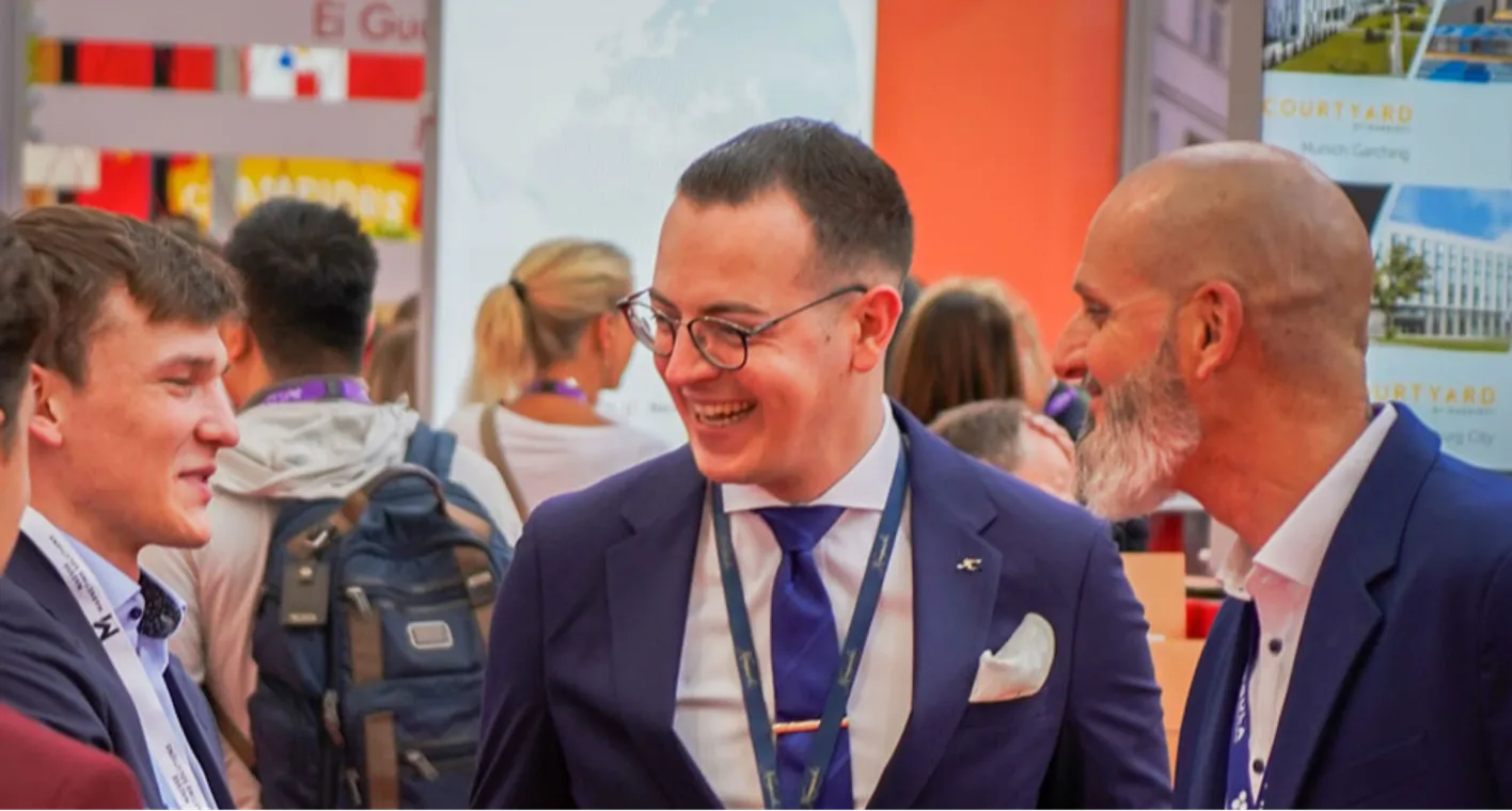 Meetings professionals from various industries connecting and exchanging ideas at a busy show floor