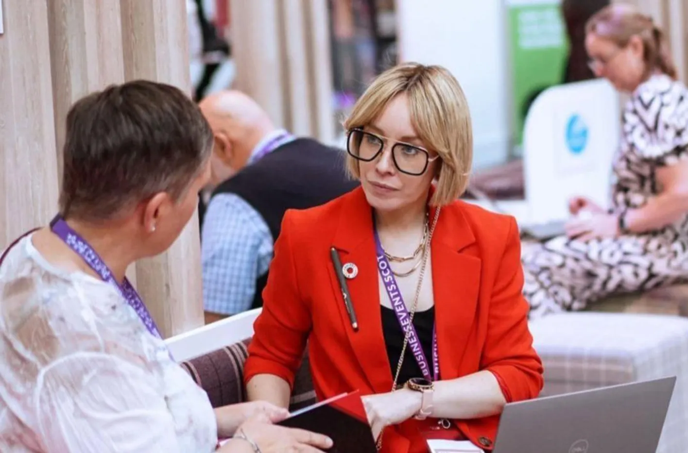 Discussion between two event professionals on a booth