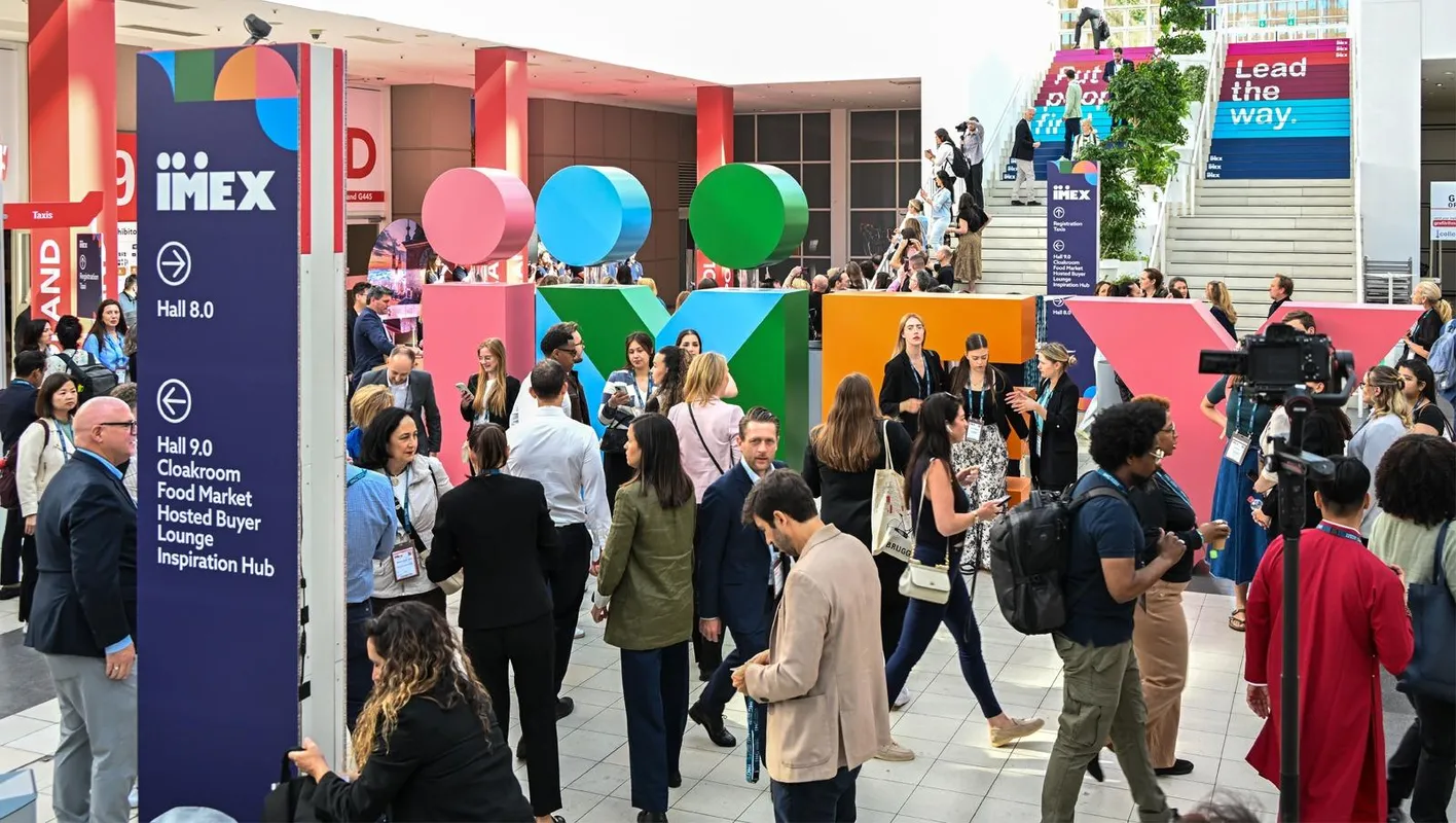 Crowds in front of the large, multi-colored IMEX letters in the galleria at IMEX Frankfurt
