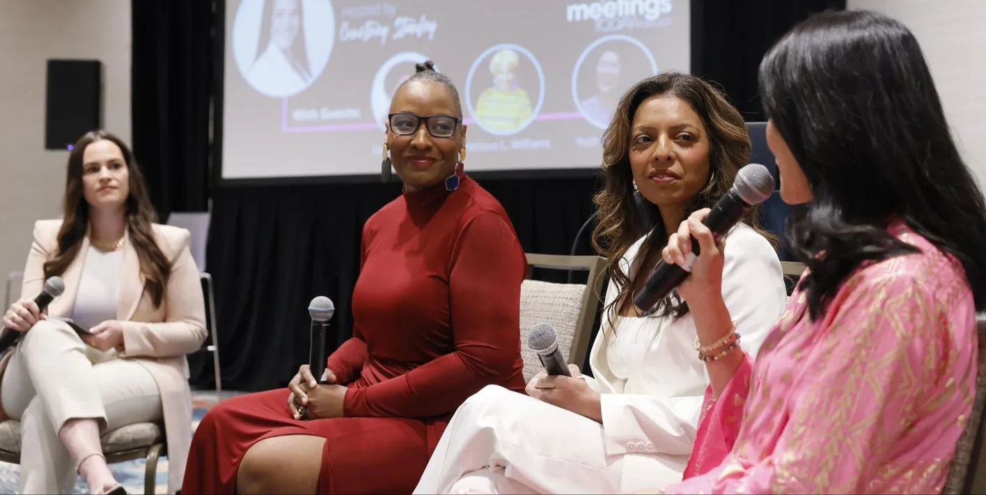 Event professional speaking at a She Means Business session focused on empowerment and leadership