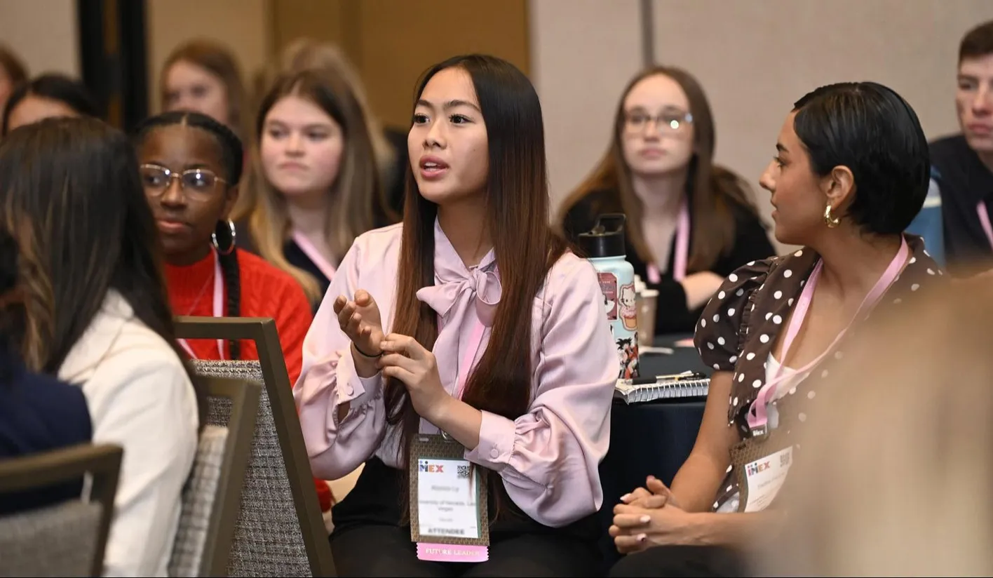 Students gazing towards the stage during a future leaders forum education session