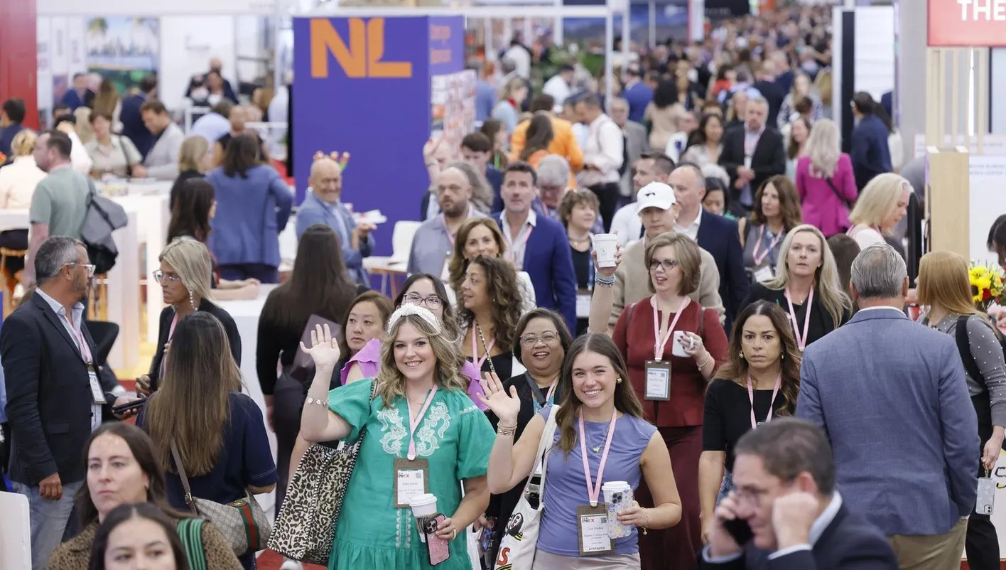 event professionals walking down the busy aisles on the showfloor