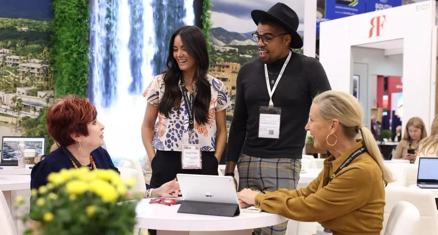 Exhibitors talking at elaborate booth