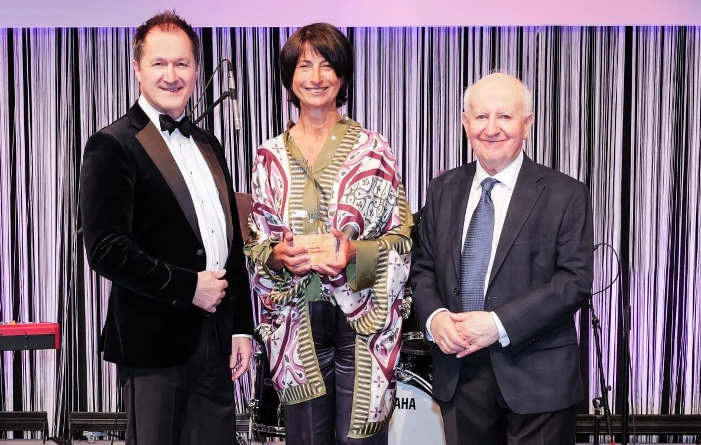 Award winners smiling at the camera