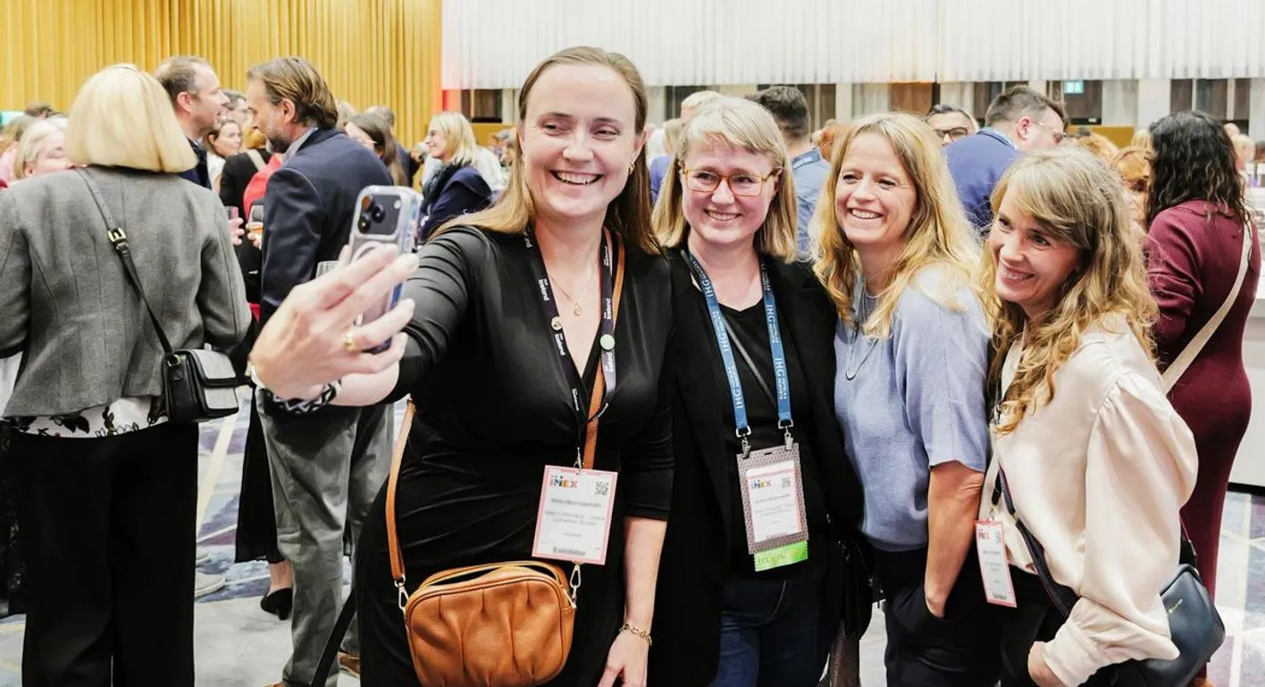Four attendees smiling for a photo at IMEX Frankfurt's Association Focus. 