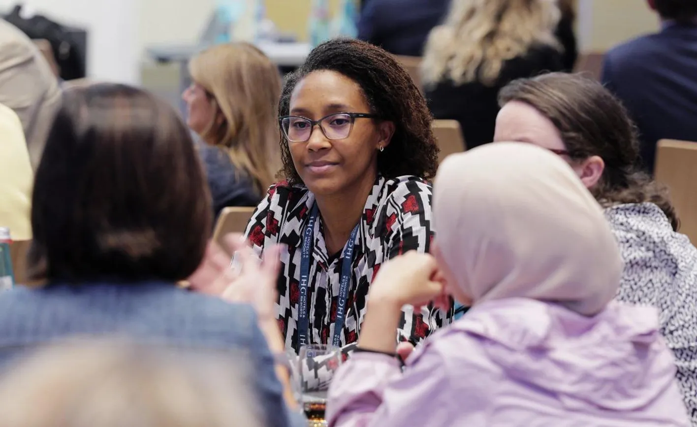 Professionals networking at Association Focus while seated on a roundtable