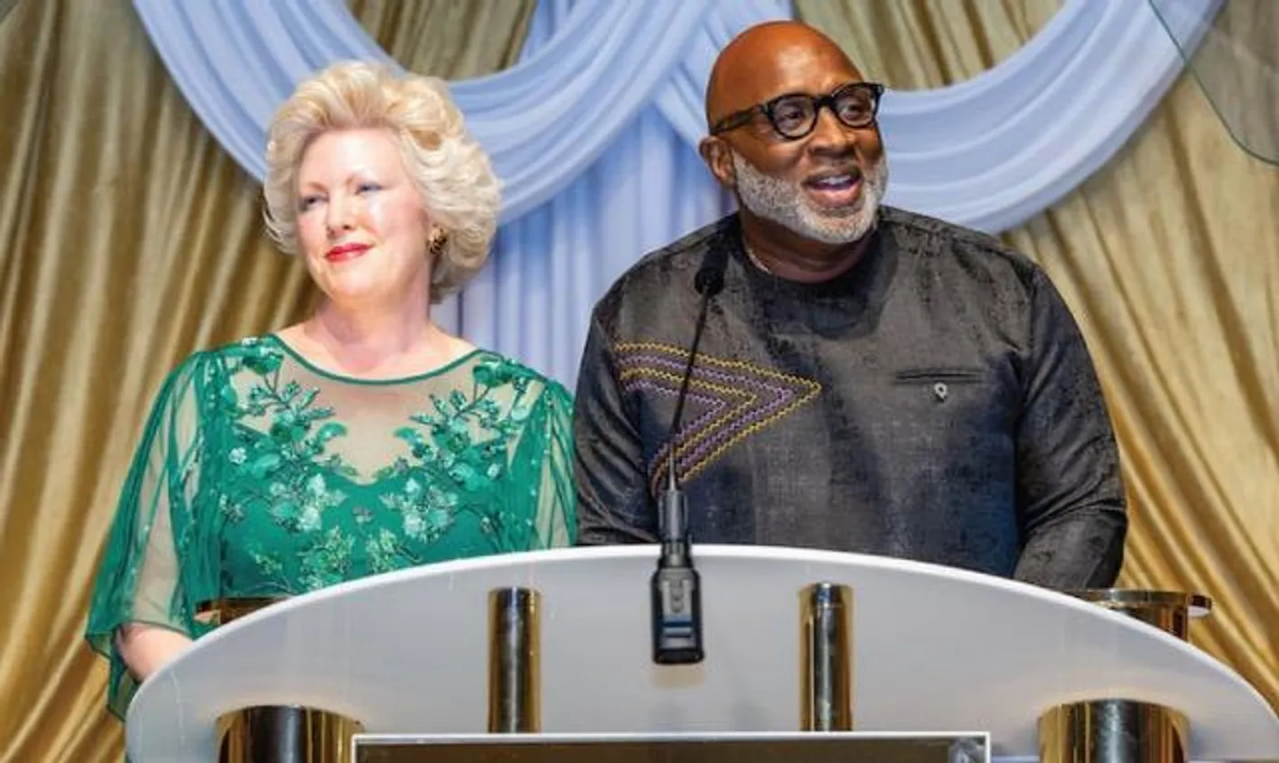 Natasha Richards and  on stage and smiling to the audience during the EIC global awards celebration