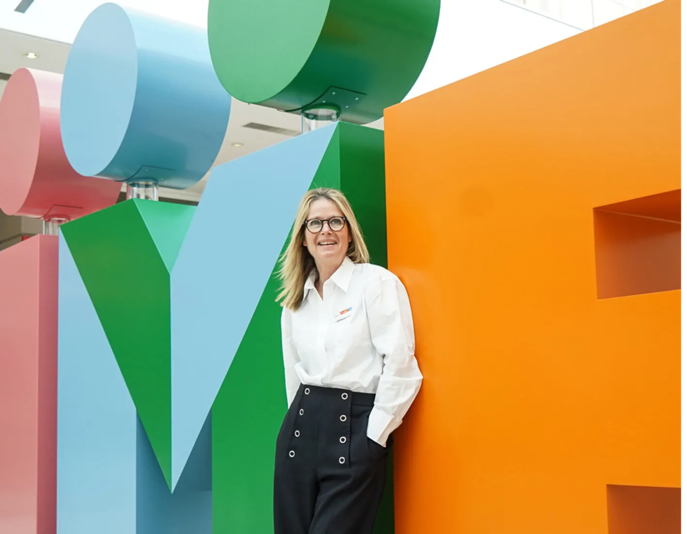 Anna Gyseman in front of the IMEX letters in the galleria, Messe 