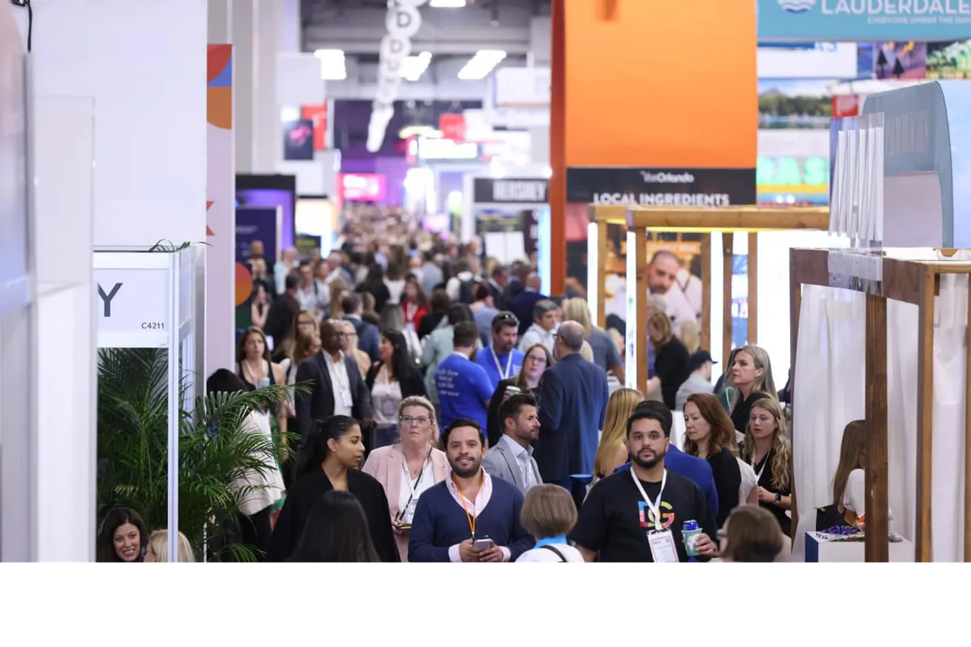 Crowds mingling and engaging in face-to-face meetings across the tradeshow venue