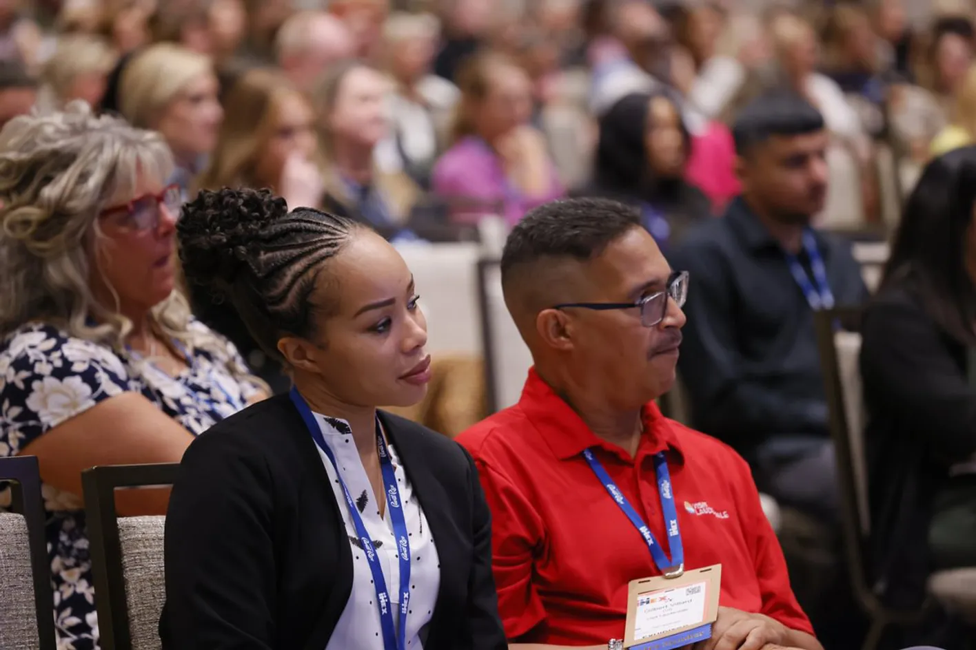 Corporate event planners engaged during an educational panel discussion
