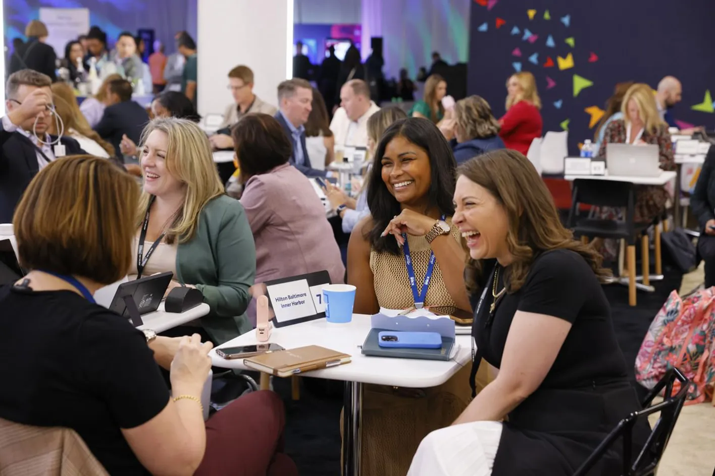 Hosted buyers gathered around a table engaged in conversation