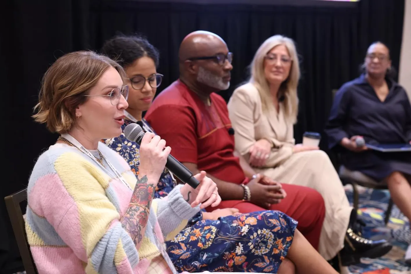 Megan Henshall speaking during a panel discussion