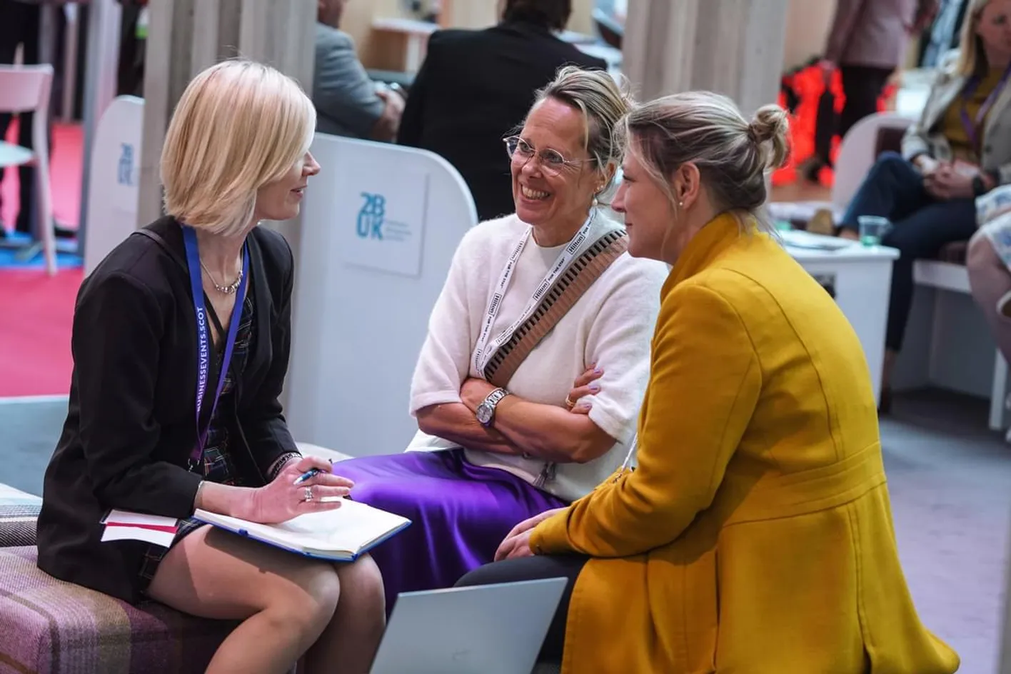 Attendees networking on the tradeshow floor at IMEX