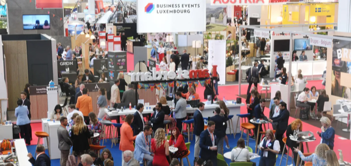 Busy IMEX Frankfurt floor with attendees networking and holding face-to-face meetings