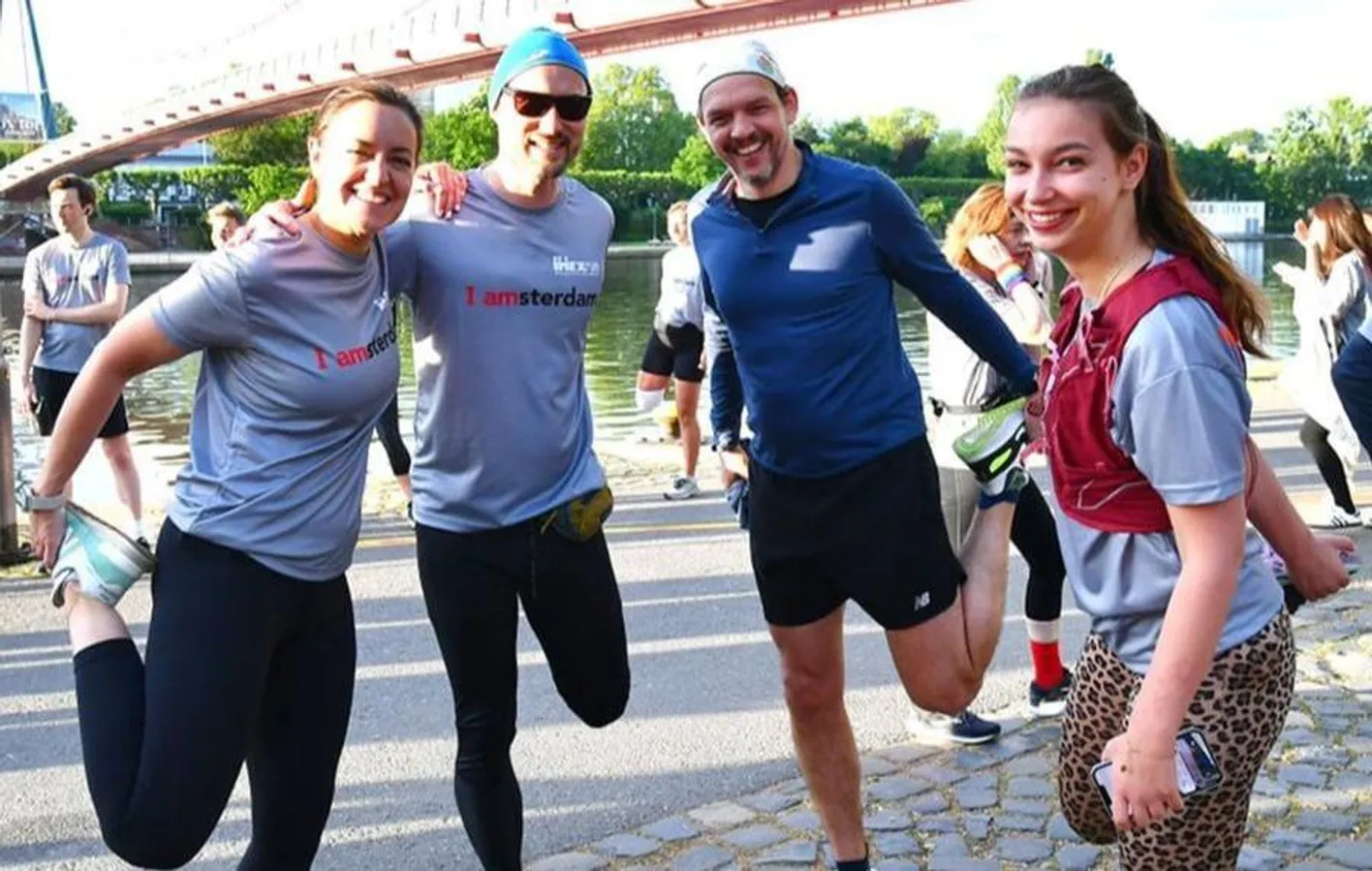 Four people stretching before IMEX Frankfurt's IMEXrun event