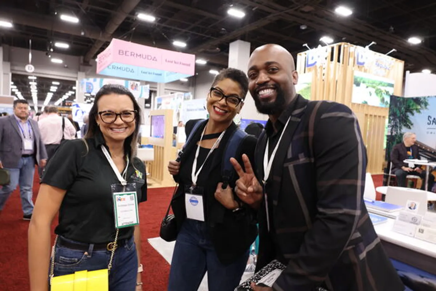 Small group of people networking at IMEX event.