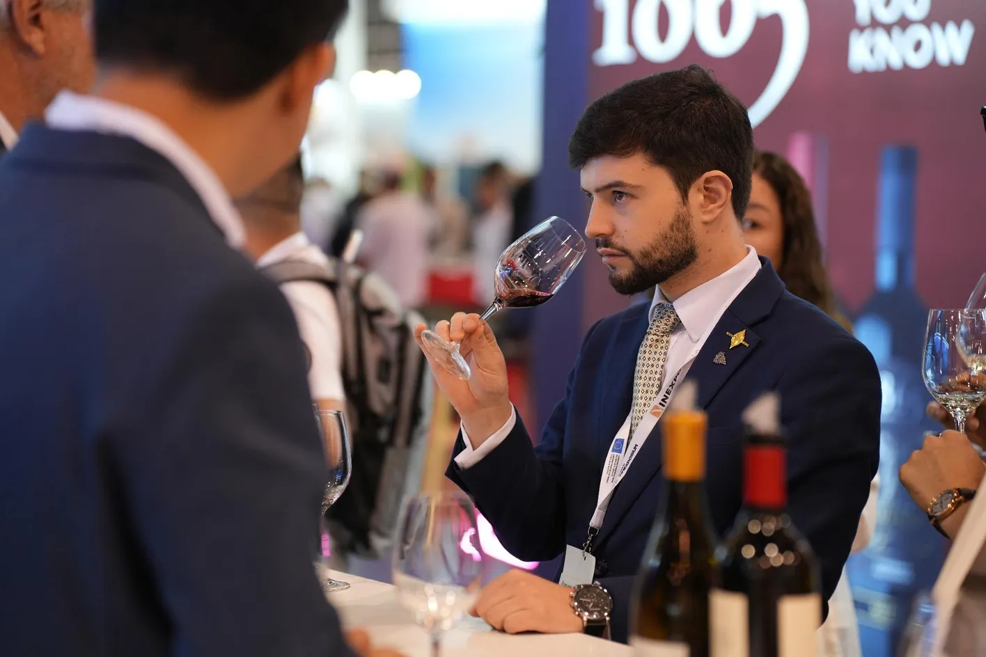 a man tasting wine at Vinexpo Asia
