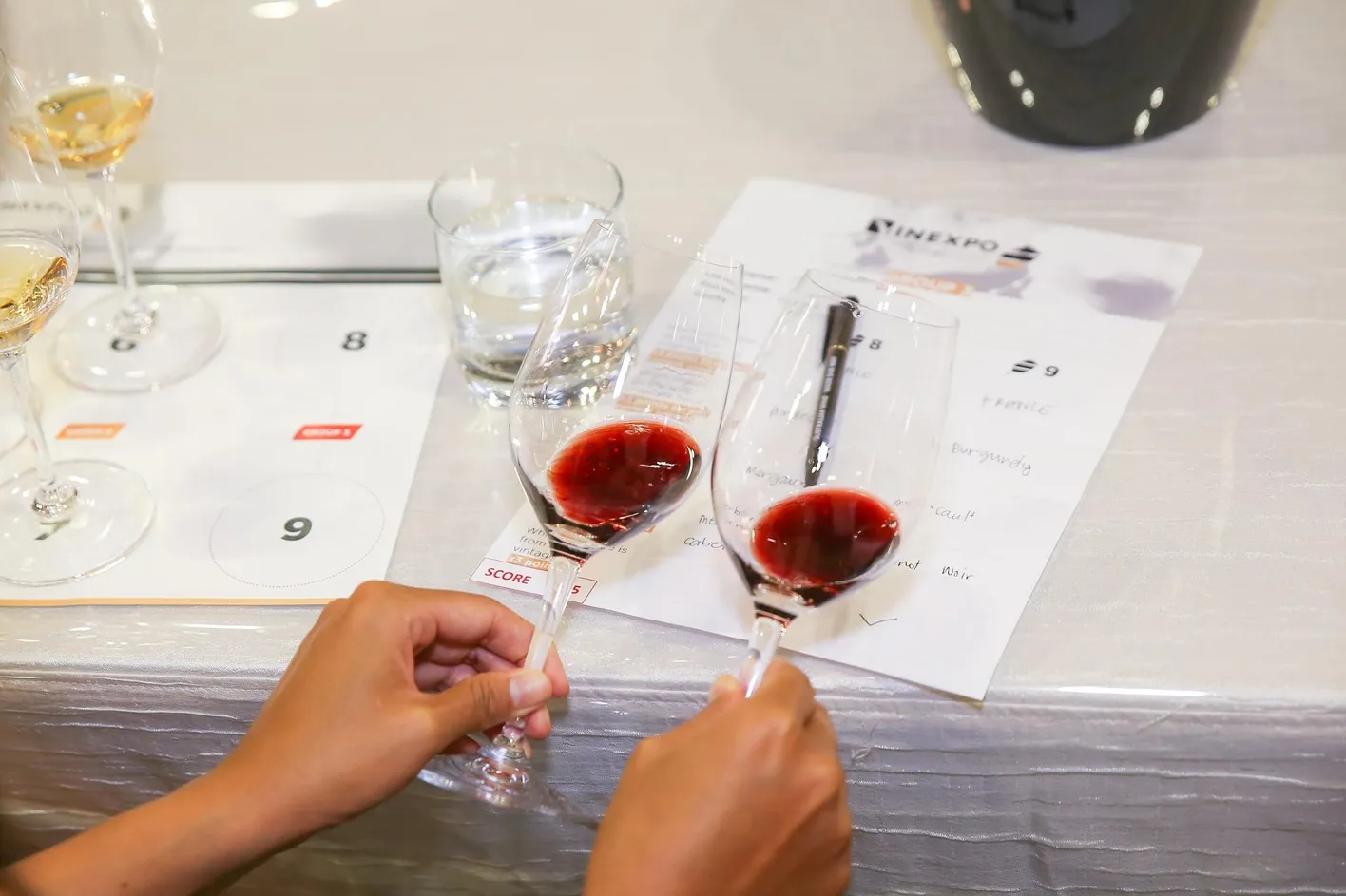  tasting wine at Vinexpo Asia
