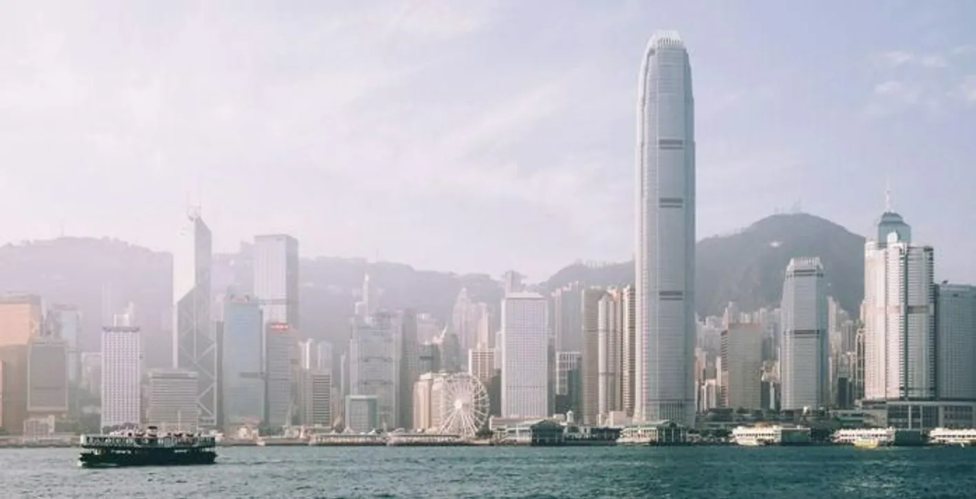 View of Hong Kong skyline and Victoria Harbour under clear skies
