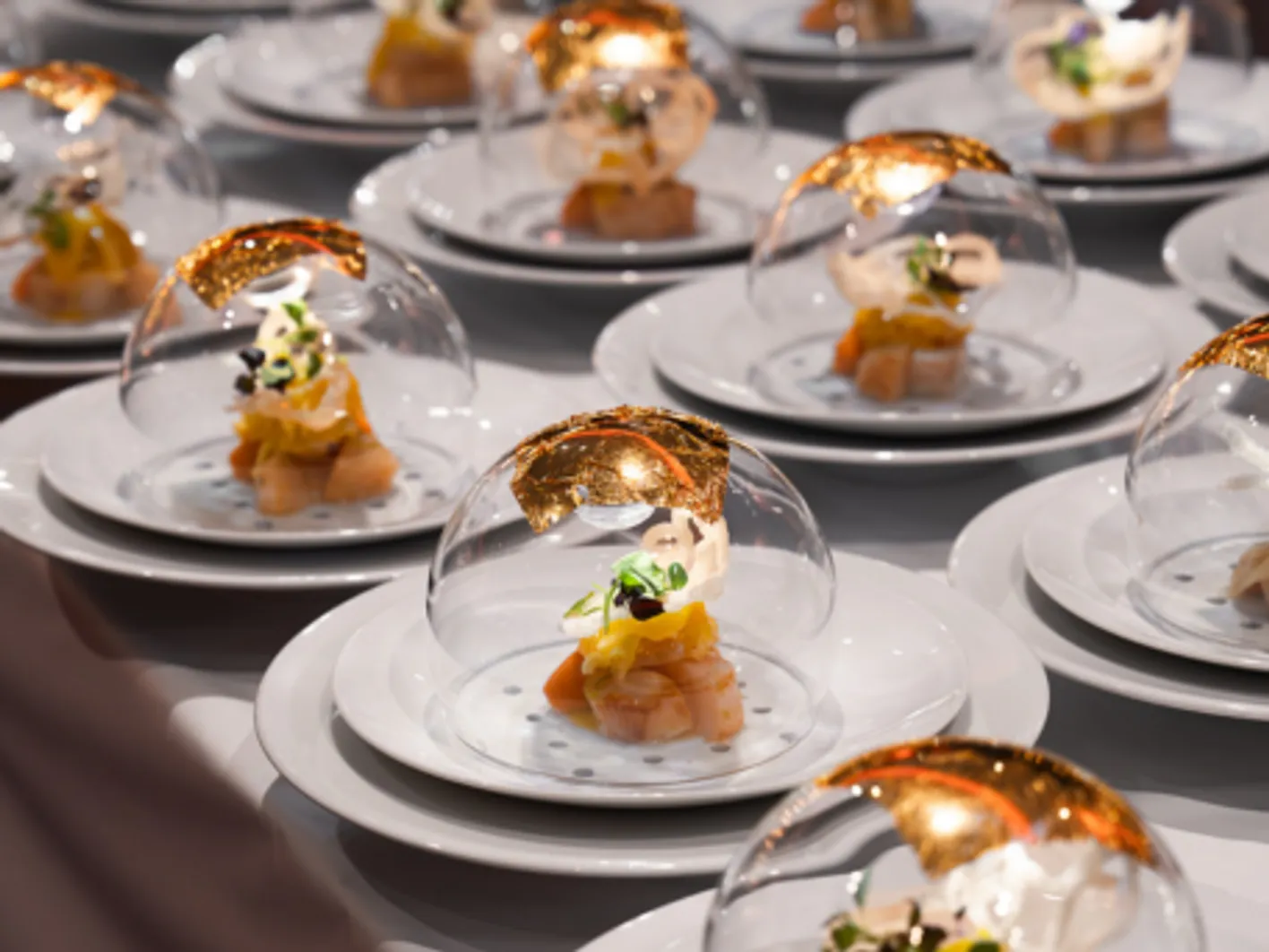 Plated gourmet dishes served at a Vinexpo Asia club invitation event
