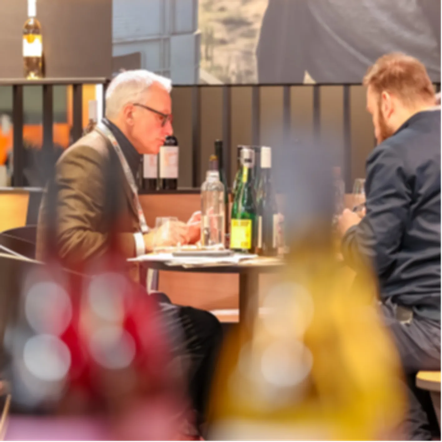 Buyer discussing products and sourcing with an exhibitor