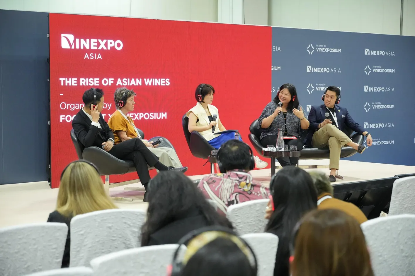 Speakers participating in a Vinexpo Academy panel discussion