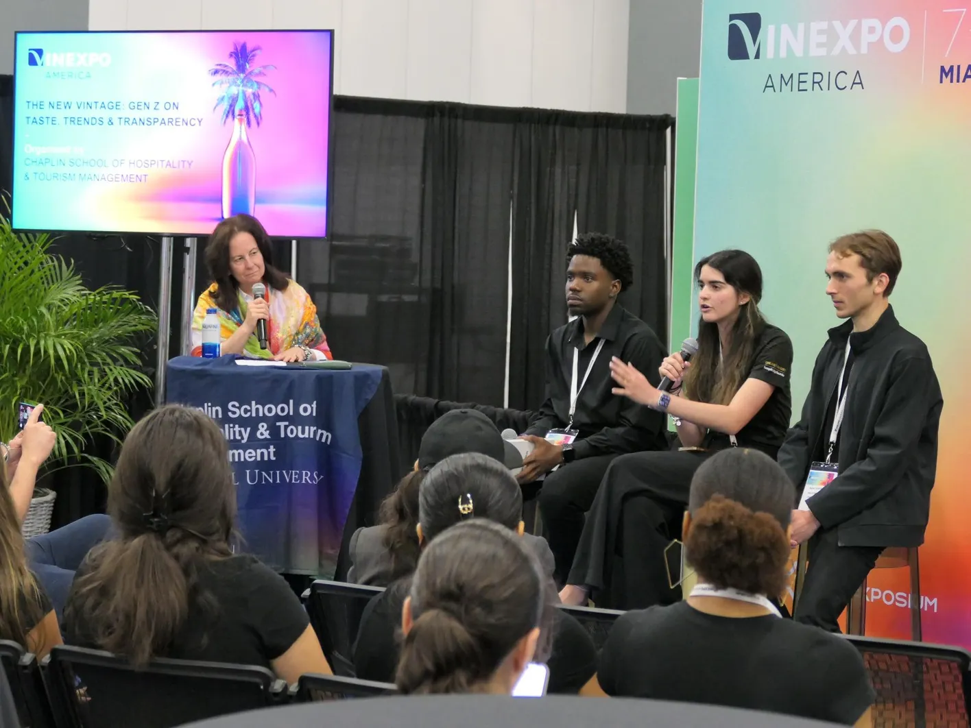 Three speakers during a masterclass at Vinexpo Americas.