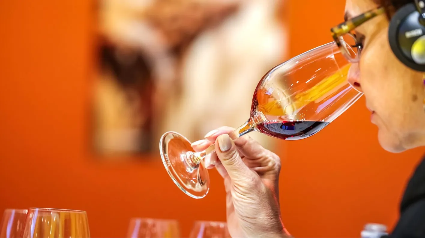 Wine expert pouring wine during an insights and industry updates session at Wine Paris