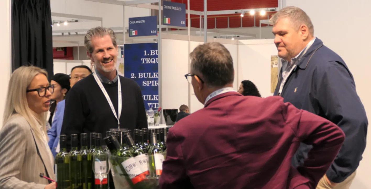 Exhibitors who are talking friendly to each other.