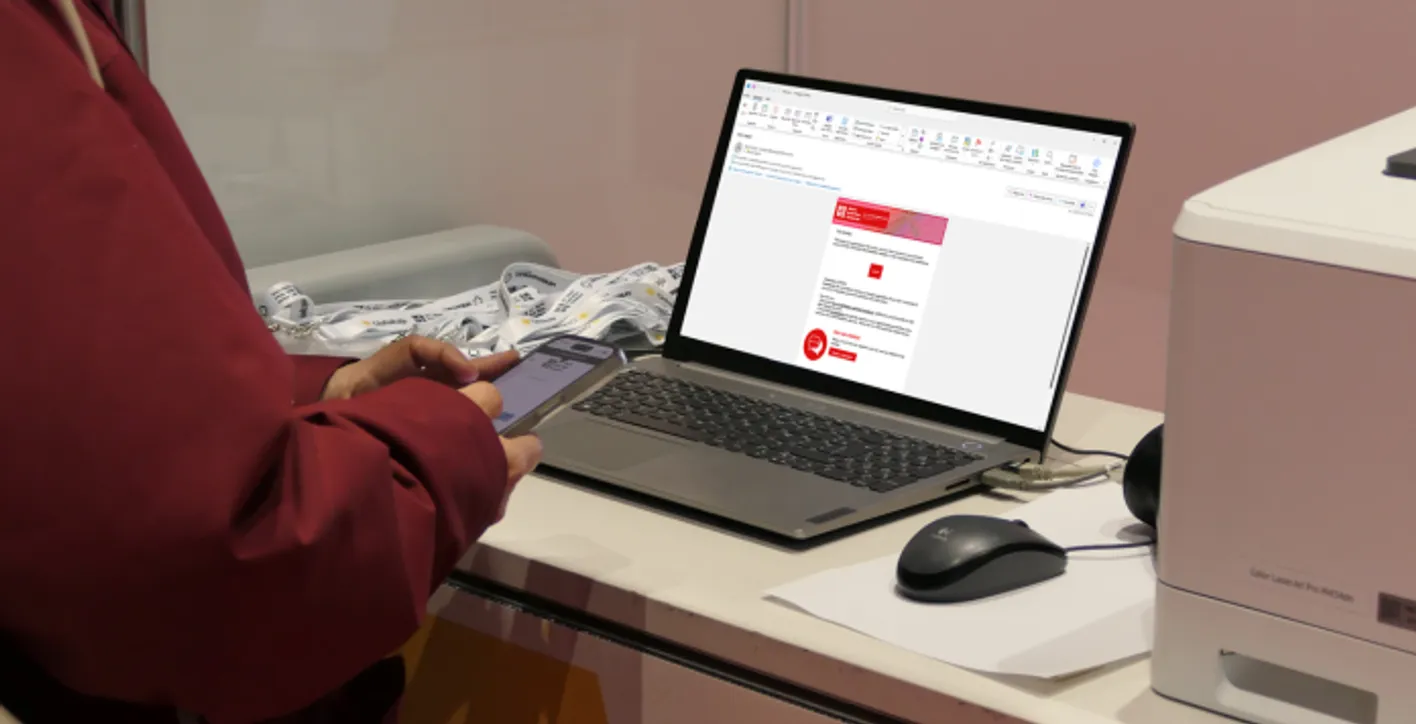 WBWE emailing on a laptop.
