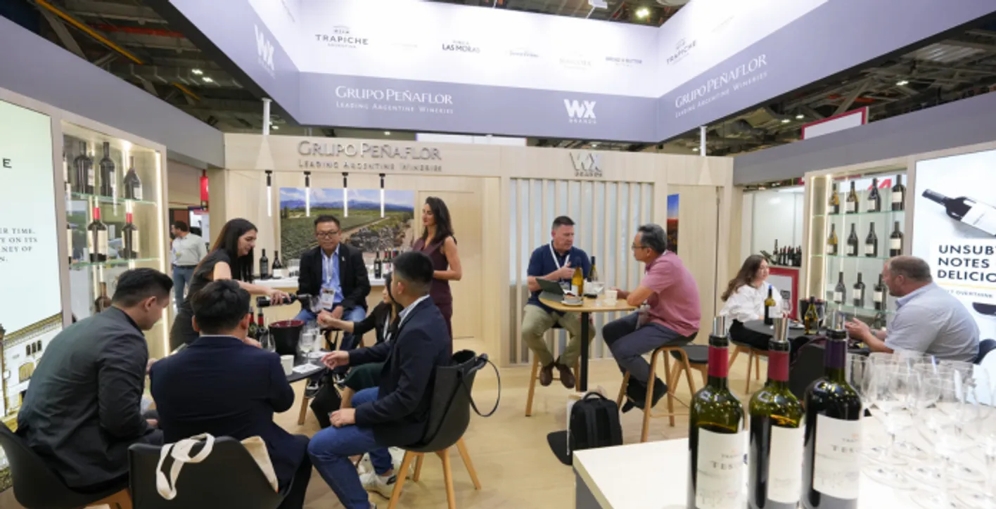 Large crowd of visitors walking through the Vinexpo Asia exhibition area