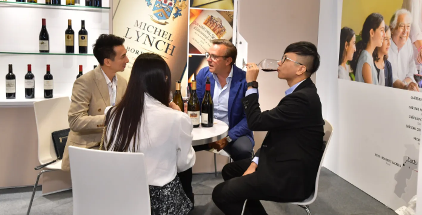 Large crowd of wine professionals and visitors at Vinexpo Asia exhibition area