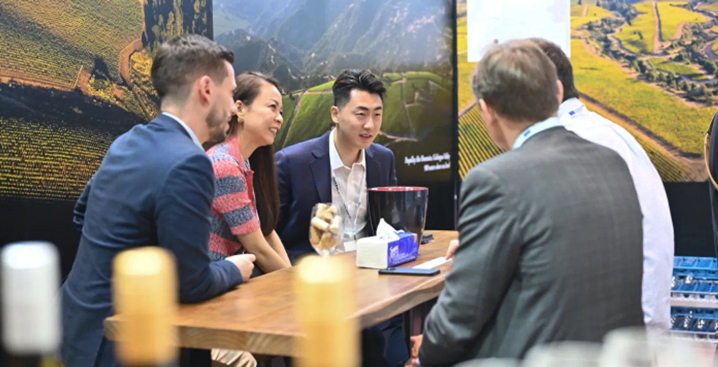 Large crowd of wine professionals and visitors at Vinexpo Asia exhibition area