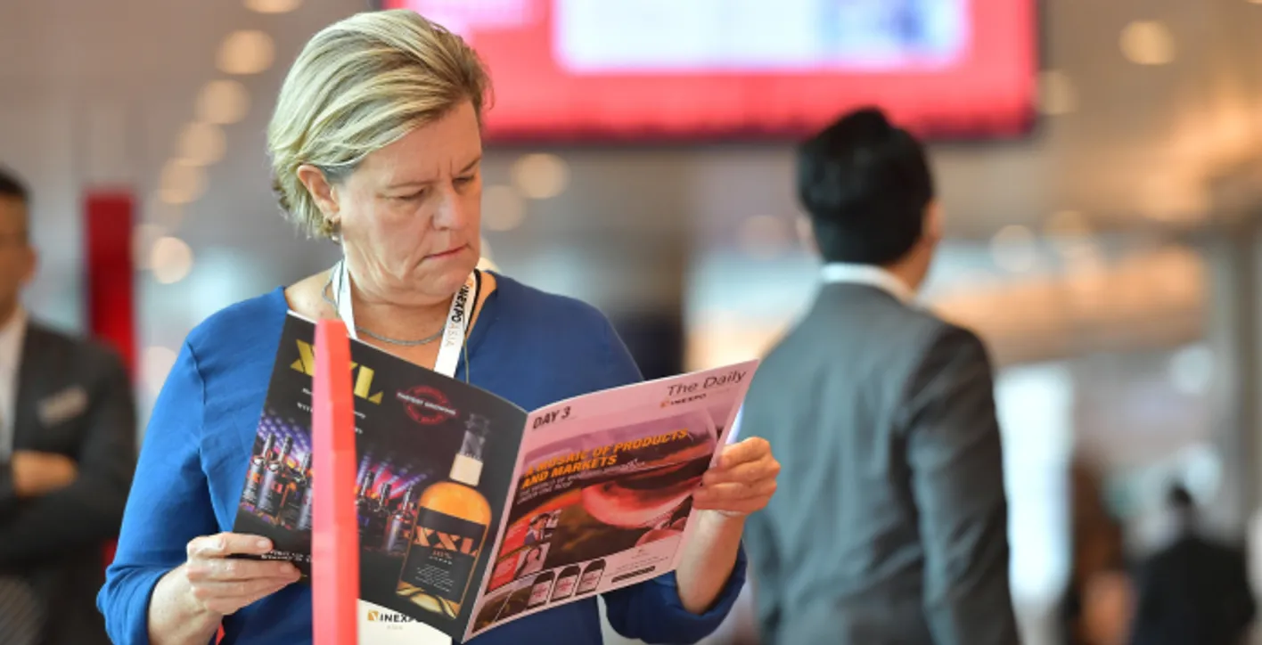 Large crowd of wine professionals and visitors at Vinexpo Asia exhibition area