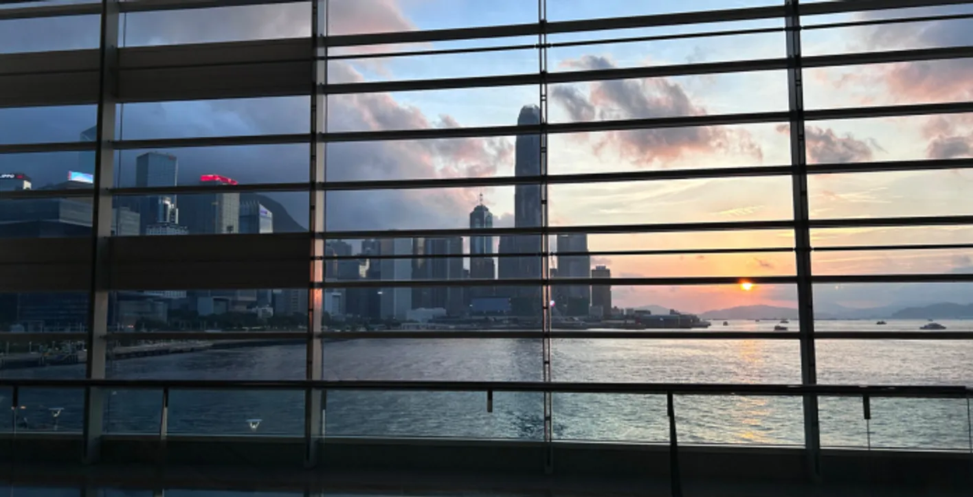 View of Hong Kong skyline and Victoria Harbour under clear skies