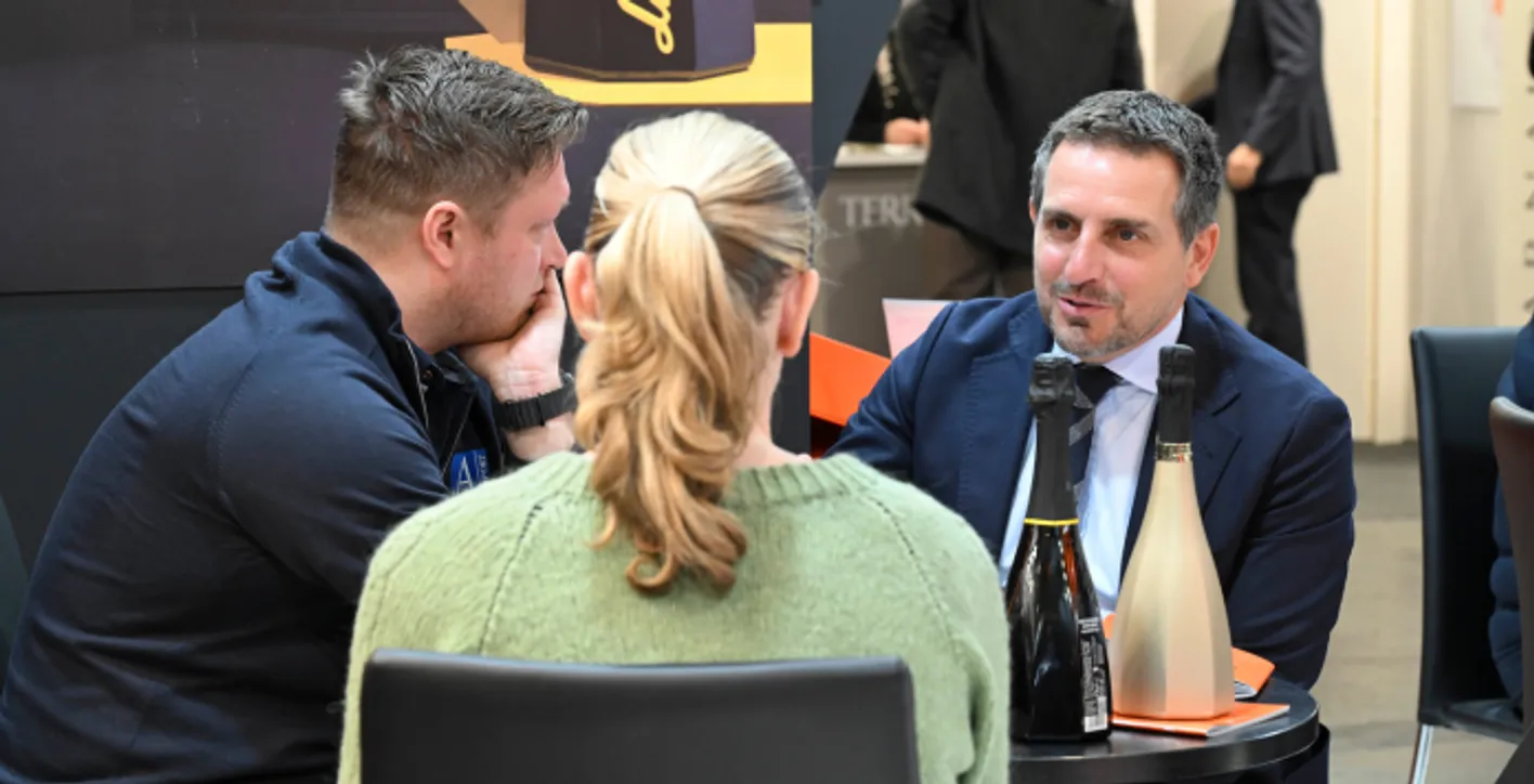 3 people talking for business in wine paris event