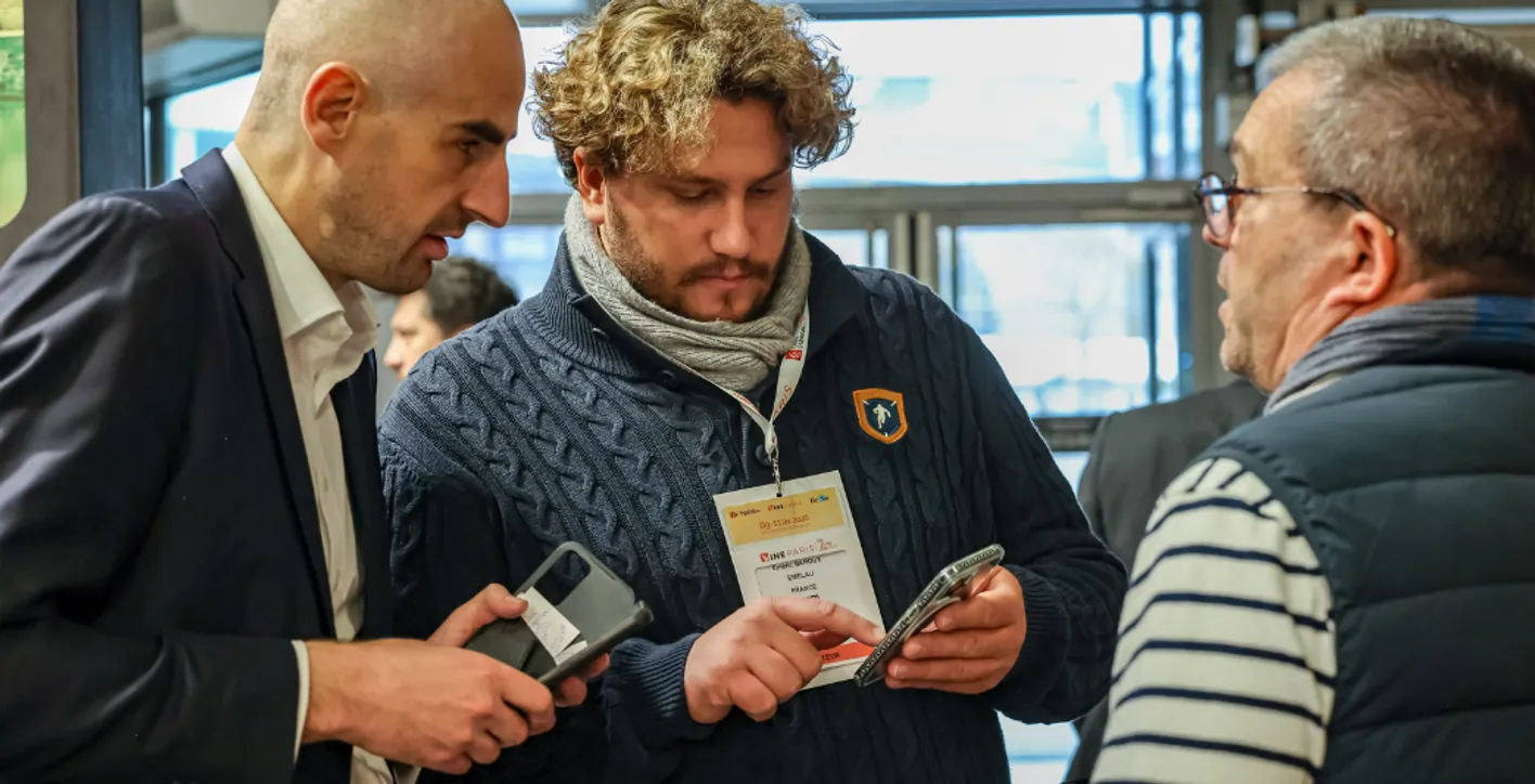 men watching a smartphone to book a meeting