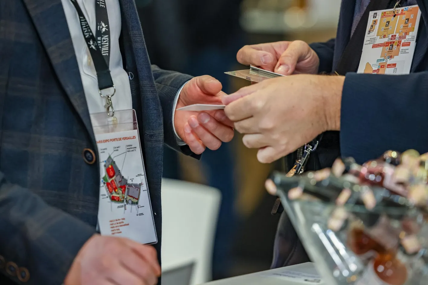 zoom on hands exchanging business cards