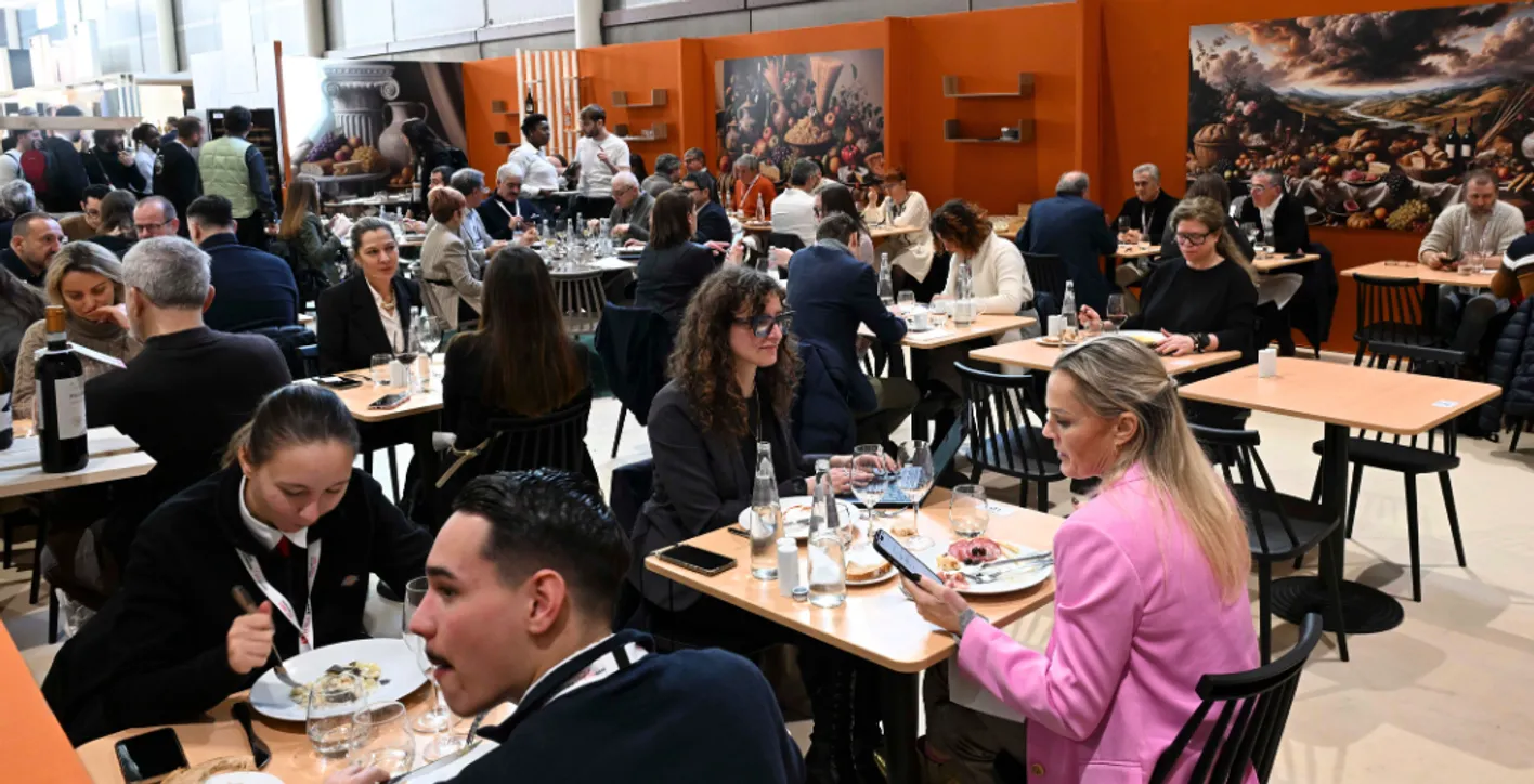 People who are eating at the restaurant at Wine Paris.