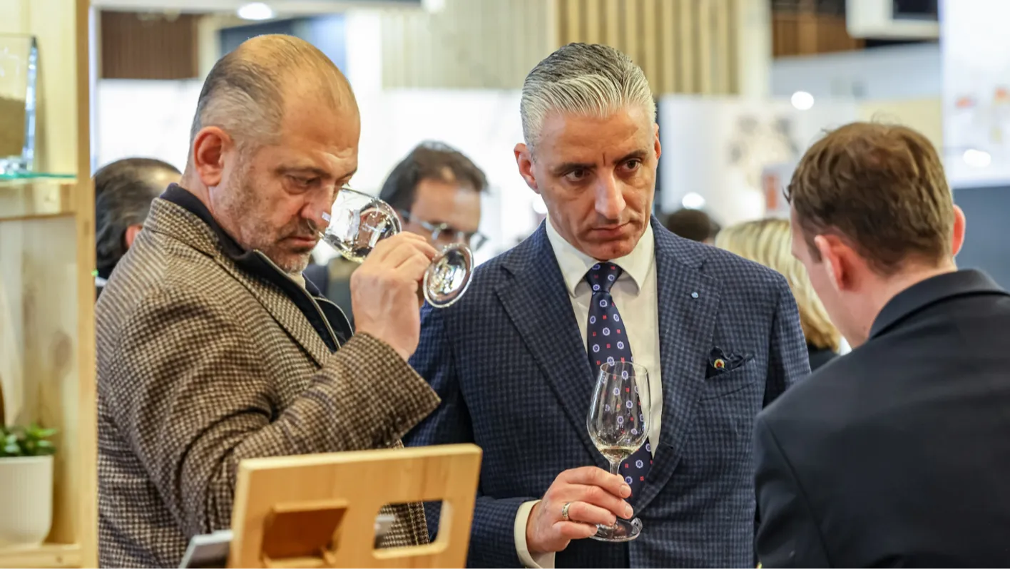 men talking about wine at the trade show