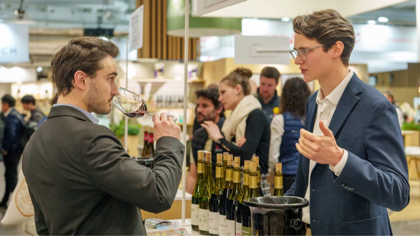 men talking about wine at the trade show
