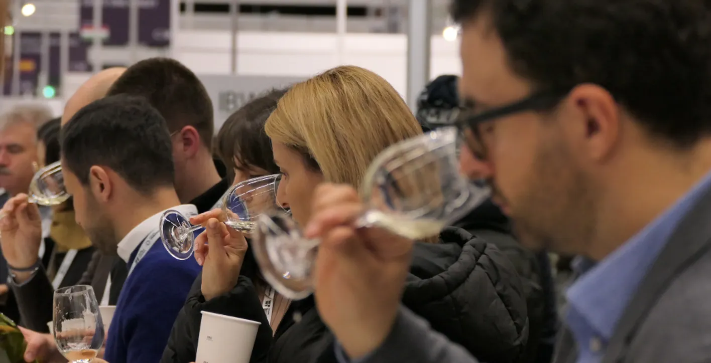 people smelling glasses of wine